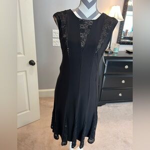 Super cute black dress with sequins. Taupe lining.
